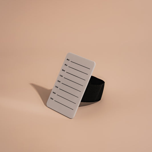Lash board with elastic hand grip and length guide.